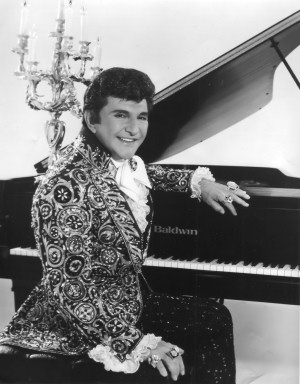 Liberace at the piano